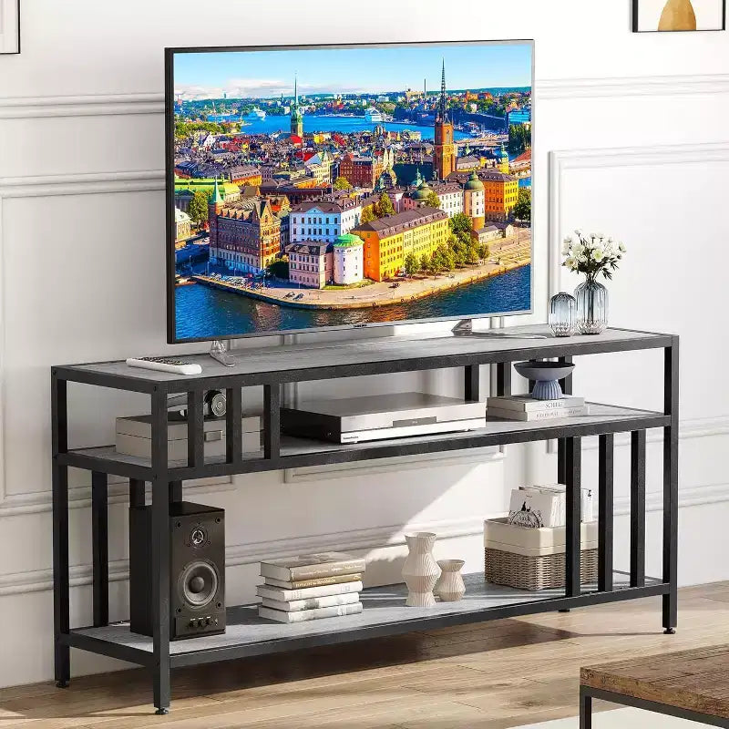 Meuble TV 65" pour téléviseurs jusqu'à 75", meuble de divertissement gris avec étagères de rangement ouvertes et support quadruple-tube